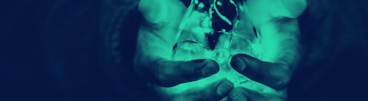 Hands holding a lightbulb
