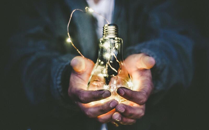 Hands holding many lights